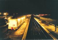 Stirling on a frosty evening in January 1995 and a view south from the footbridge which connects the main station with Platforms 9 and 10.  The building on the left did not survive much longer.<br><br>[David Panton 05/01/1995]
