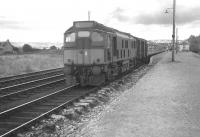 The morning train for Kyle of Lochalsh pulls away from Dingwall in August 1966.<br>
<br><br>[Colin Miller /08/1966]