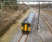 A 153 unit on a Preston to Ormskirk service has just joined the single line at Farington Curve Junction on 13 March 2010. The tracks on the right lead to Lostock Hall and East Lancashire while the WCML can be seen in the background. <br>
<br><br>[John McIntyre 13/03/2010]