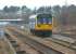 The early afternoon Blackpool South to Colne service passes the CE sidings at Bamber Bridge on 14 March 2010 in the hands of 142051. The former direct line to Preston via Todd Lane ran off to the right behind the unit.<br>
<br><br>[John McIntyre 14/03/2010]