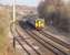 A Blackpool to Liverpool service, formed by Northern Sprinter 156468, approaches Preston and runs through the cutting immediately east of Maudlands Viaduct. If the Blackpool electrification plans are implemented the mast in the foreground will no longer mark the end of the wires on this line. <br><br>[Mark Bartlett 10/04/2010]