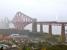 In conditions best described as 'atmospheric', no 70013 <I>Oliver Cromwell</I> heads north off the Forth Bridge with the morning SRPS <I>Forth Circle</I> rail tour on Sunday 18 April 2010. The train is running wrong line due to work being carried out on the bridge that morning.<br><br>[Andy Carr 18/04/2010]