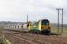 Freightliner <i>Powerhaul</i> locomotive no 70005 takes a loaded coal train bound for Longannet past Larbert Junction on 22 April 2010<br><br>[James Young 22/04/2010]