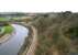 View west from Larpool viaduct on 23 March 2010 showing the Whitby and Pickering Railway running alongside the Esk towards Grosmont. The pathway on the right is the trackbed of the former link via Prospect Hill Junction that climbed steeply from the W&P before swinging north to join the Scarborough - Whitby - Middlesbrough coastal route near Whitby West Cliff station at the northern end of the viaduct. [See image 23574]<br><br>[John Furnevel 23/03/2010]