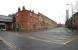 The Manchester Liverpool Road station building of the Liverpool & Manchester Railway is often considered the world's first passenger terminus. It is seen at street level on 4 February 2010 almost 180 years after it was opened on 15 September 1830 by the Duke of Wellington. Although it only operated as a passenger station until May 1844, it continued in use as a goods depot until 1975. The red brick building on the corner, which predates the station itself, was purchased by the railway company and used as the superintendent's house. Today the station forms part of the Manchester Museum of Science and Industry and still contains several original features.<br>
<br><br>[John McIntyre 04/02/2010]