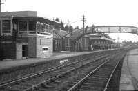 The distinctive signal box and substantial station building at Grantown-on-Spey West, still extant in April 1968, three years after closure - but alas now long gone.<br><br>[David Spaven /04/1968]