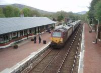 The Fort William portion of the Sleeper service from Euston rolls into its penultimate stop at Spean Bridge behind DBS 67007. View looking east from the overbridge on 19 May.  <br><br>[Mark Bartlett 19/05/2010]