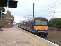 The almost disturbing (but welcome) site of a ScotRail unit at Dunbar, in this case 322481 with the 1504 to Edinburgh on 28 May.  ScotRail trains have not served Dunbar since 1990, when the twice-daily local service was withdrawn due to a shortage of DMUs [see image 24208]. With the new timetable this week two weekday services make a return trip: one mid-morning, one mid-afternoon.  This leaves Lockerbie as the only Scottish station not served by ScotRail.<br><br>[David Panton 28/05/2010]