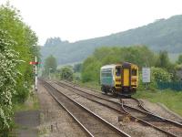 Arriva Trains Wales single unit DMU 153320 runs onto the 'Heart of Wales' Line on 25 May after leaving the northbound platform at Craven Arms with the 14.36 service to Swansea.<br><br>[David Pesterfield 25/05/2010]