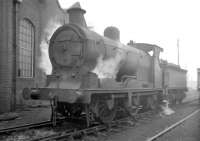 Pickersgill 0-6-0 no 57679 stands alongside the main shed building at 64C Dalry Road on a grey looking 3 January 1958. The compact former Caledonian shed, always overshadowed by its larger city neighbours, was officially closed in October 1965 and demolished a short time thereafter. The site is now part of Edinburgh's Western Approach Road. <br><br>[Robin Barbour Collection (Courtesy Bruce McCartney) 03/01/1958]