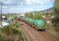Having waited alongside the Mallaig line for a Glasgow bound Sprinter to clear the section, [See image 29132] 66099 propels four empty fuel tanks back to the Fort William Junction signal so that it can follow the passenger train south. <br><br>[Mark Bartlett 18/05/2010]