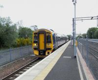 158 707 <I>Far North Line</I> prepares to leave platform 3 at Anniesland with the next service to Glasgow Queen Street on 3 June 2010. It would be nice to think that, with glorious synchronicity, there's a set called <I>Maryhill Line</I> about to leave Thurso... but no. <br>
<br><br>[David Panton 03/06/2010]