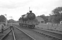 64624 in the process of running round the RCTS <I>Borders Railtour</I> at Jedburgh on 9 July 1961. The J37 had brought the train from Hawick along wth NBR 256 <I>Glen Douglas</I>, following which the special visited various branches before the pair handed over to no 60143 at Tweedmouth [see image 27903] for the journey south to Newcastle.<br><br>[K A Gray 09/07/1961]
