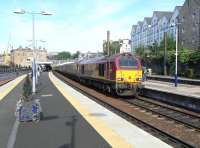 67 025 arrives at Haymarket platform 2 on a sunny 4 June 2010 with the evening loco-hauled Fife Outer Circle service.<br><br>[David Panton 04/06/2010]