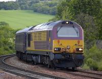 67025 rounds the curve at Inverkeithing Central Junction with an SRPS excursion from Glenrothes to Liverpool on 12 June. 67030 provided the tail lamp!<br>
<br><br>[Bill Roberton 12/06/2010]