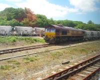 Grab shot of a China Clay train from the Rocks complex, taken from a passing Newquay branch train that it followed when the single line to Par cleared. 66093 was taking the loaded clay wagons to the port at Fowey via reversal at Lostwithiel. <br><br>[Mark Bartlett 15/06/2010]
