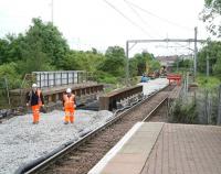 End of the line. The line to Drumgelloch shown terminated at buffer stops just beyond Broomknoll Street bridge, east of Airdrie station, on 14 June 2010. Work on the double track Airdrie - Bathgate link continues in the background. [See image 9670]<br><br>[John Furnevel 14/06/2010]