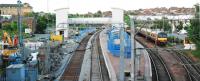 Development continues at Airdrie with the eastbound sleepers now in place and footbridge more complete.<br><br>[Ewan Crawford 27/06/2010]