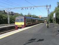 320 315 arrives at Dumbarton Central on 19 June with a Balloch to Airdrie service.<br><br>[David Panton 19/06/2010]