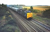 An unidentified <I>Deltic</I> takes an up train past the site of Aberlady Junction on the ECML in 1978. The trackbed of the former Gullane branch can be seen on the right. <br><br>[Bruce McCartney //1978]