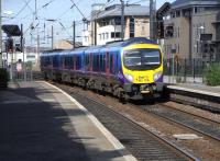 First TransPennine 185 506 pulls into Haymarket on 15 June with the early morning Manchester Airport - Edinburgh Waverley service.<br><br>[David Panton 15/06/2010]
