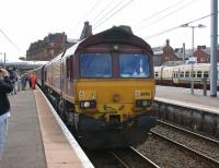 DBS 66016 couples up to the stock on platform 4 at Ayr for the <br>
return Compass Tours <I>Ayrshire Coast Explorer</I> to Broad Green on 3 July 2010. <br>
<br><br>[John McIntyre 03/07/2010]