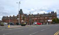 The impressive red sandstone frontage of Ayr station and The Station <br>
Hotel viewed looking east across Smith Street on 3 July 2010.<br>
<br><br>[John McIntyre 03/07/2010]