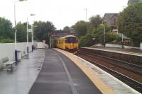 View south at Inverkeithing station on 10 July 2010 showing a Network Rail inspection unit standing at the platform.  The unit has just arrived 'wrong line' from Inverkeithing South Junction after coming off the Rosyth Dockyard branch. The tail lights have just been switched on and a member of the crew is about to return the token to the padlocked box on the fence by the signal before heading off on the main line towards Edinburgh.<br><br>[Grant Robertson 10/07/2010]