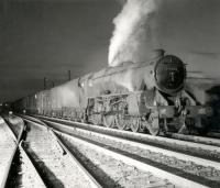 Black 5 no 45053 poses with a freight. View is thought (?) to have been taken to the south of Perth with the shed just over to the right. The photograph was used as part of a BR Scottish Region freight promotion in the late 1950s.<br><br>[Ken Browne Collection //]