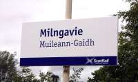 Scotrail is keen to render celtic-based placenames into Gaelic on <br>
bilingual station signs.  Milngavie is from the gaelic for, apparently, either windmill or Gavin's mill.  I've no problem with Muillean (mill) but there doesn't seem to be such a word as 'Gaidh'.  Is this just an attempt to render 'guy' into Gaelic to tie in with the pronunciation? Photographed on 14 July 2010.<br>
<br><br>[David Panton 14/07/2010]