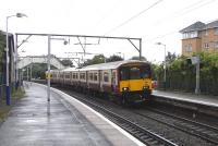 318 268 with a Lanark service at Jordanhill on 14 July. This station achieved a little fame in the internet world when, on 1 March 2006, Jordanhill Railway Station became the one millionth entry on Wikipedia. This not mentioned on Wikipedia itself (though perhaps there's no reason why it should). <br>
<br><br>[David Panton 14/07/2010]