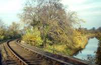 The Balerno branch - seen here crossing the Union Canal looking towards Balerno Junction - lost its passenger services in 1943, but freight would survive for another three years after this photograph was taken on 2nd November 1964. Much of the route is now an attractive walkway following the densely wooded valley of the Water of Leith.<br><br>[Frank Spaven Collection (Courtesy David Spaven) 02/11/1964]