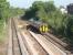 Although much of the once lengthy island platform at Poulton has recently been removed [See image 28793] the infill material has not been taken away and a staff access walkway now seems to be being created. 158816 passes the site as it approaches the station on a York to Blackpool North working. <br><br>[Mark Bartlett 22/06/2010]