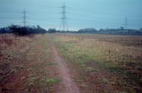 Not far from Morningside (behind the camera) looking to Stirling Road on a December evening in 1987. The Coltness Iron Company (later Costain) line ran from the distant centre to the right. The distant bing belonged to the Gillhead Colliery. The line seen here was later re-opened and this view can be compared with the scene 23 years later [see image 29593].<br><br>[Ewan Crawford /12/1987]