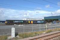 Class 37 and 66 locomotives stand in the sun at the south end of the DRS Kingmoor depot on 3 July 2010.<br><br>[John McIntyre 03/07/2010]