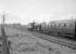 A westbound train approaching Drem behind an unidentified B1 in April 1964. The train may be the late running (or retimed) former 3.45pm ex-Dunbar, bound for Waverley. <br><br>[Robin Barbour Collection (Courtesy Bruce McCartney) /04/1964]