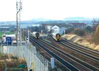 Passing 158s at Saughton in December 2002. On the left a train from Dunblane is approaching, while on the right Fife Circle train turns north towards the Forth Bridge.<br><br>[John Furnevel 11/12/2002]