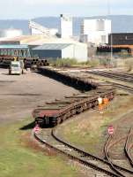 Unloading a pipe train in Leith South yard, north sidings, in April 2005.<br><br>[John Furnevel 11/04/2005]