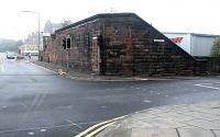 View north west across Bonnington Toll in 2002, with Newhaven Road on the right and Bonnington Road left. The combined wall and bridge abutment opposite is all that survives of the Caledonian Railway's Rosebank Goods depot, in use as a small retail park at that time..<br><br>[John Furnevel 06/10/2002]