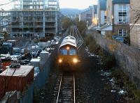 An EWS class 66 locomotive arriving at Powderhall in October 2004 to pick up the early morning Binliner for Oxwellmains.<br><br>[John Furnevel 18/10/2004]