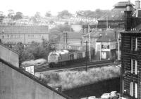 After leaving the Glasgow - Edinburgh main line at Haymarket West Junction, a class 37 brings a southbound freight past the signal box at Gorgie Junction in May 1975.<br><br>[John Furnevel 27/05/1975]