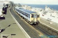 Looking north over Kinghorn Station with a southbound sprinter and the North Sea in the background.<br><br>[Ewan Crawford //]