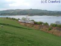 A southbound train passing Lindores Loch.<br><br>[Ewan Crawford //]