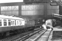 An unidentified Brush Type 4 arriving at Carlisle platform 4 from the north on 13 June 1970. Standing at platform 3 is 'Peak' D183, preparing to leave with the 1025 Leeds - Glasgow Central.<br><br>[John Furnevel 13/06/1970]