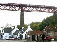 A northbound train passing over the 'Hawes Inn' on the southern approach to the Forth Bridge on 30 April 2005.<br><br>[John Furnevel 30/04/2005]