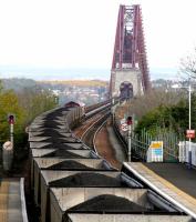 A coal train from Hunterston approaching the Forth Bridge in April 2005 after passing through Dalmeny Station with coal for Longannet.<br><br>[John Furnevel 30/04/2005]