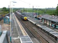 An up ECML express runs south through Alnmouth station during refurbishment works in May 2004.<br><br>[John Furnevel 26/05/2004]