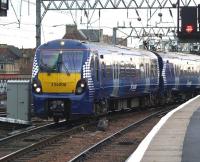 The first of the ScotRail class 334 units has now appeared in Saltire livery. Unit 334006 is seen approaching the platforms at Glasgow Central station on 16 November 2010.<br><br>[Darrel Hendrie 16/11/2010]