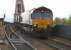 Coal train for Longannet power station drifting down from the Forth Bridge towards North Queensferry in April 2005. Note the cameraman in the cab!<br><br>[John Furnevel 28/04/2005]