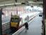 A weary looking traveller walks towards a train for Glasgow Central at Ayr station on 12 July 2002.<br><br>[John Furnevel 12/07/2002]